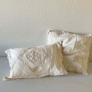 Two cream colored cotton battenburg pillow